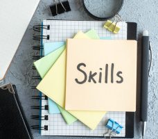 top-view-skills-written-note-with-notepad-light-background-job-office-school-copybook-college-business-colors