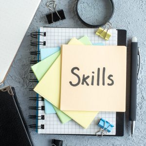 top-view-skills-written-note-with-notepad-light-background-job-office-school-copybook-college-business-colors top-view-skills-written-note-with-notepad-light-background-job-office-school-copybook-college-business-colors