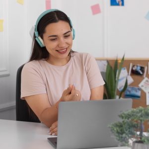 woman-having-videocall-using-laptop-device-from-home