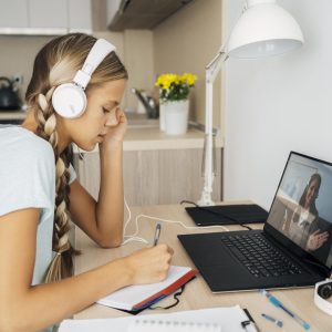 young-girl-paying-attention-online-class (1)